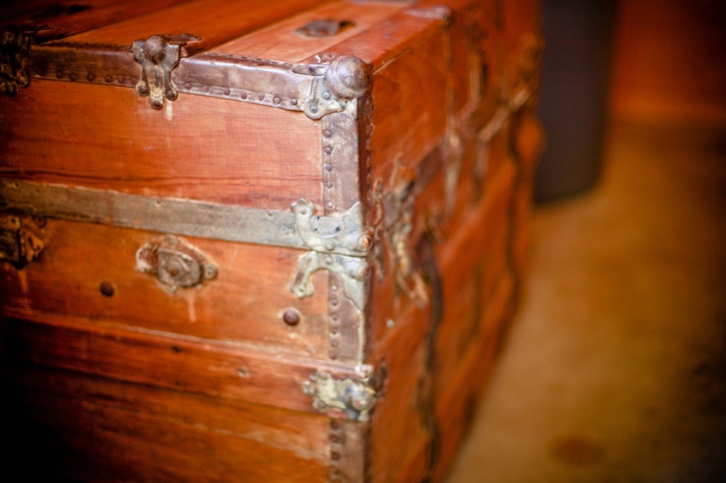 An old fashioned wooden chest in dramatic shadows.